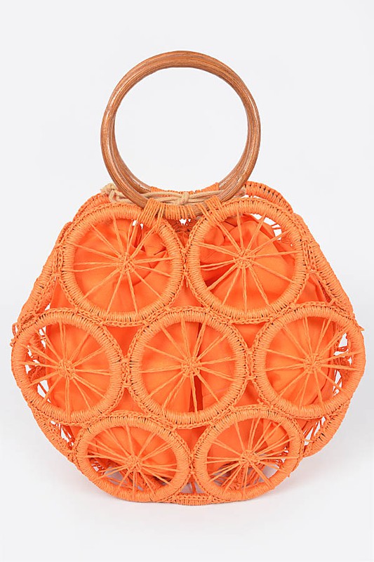 Vibrant orange woven circle purse featuring raffia wheel design and wooden handles—colorful summer tote.