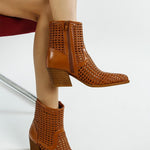 Tri-color collection of women’s woven faux-leather ankle boots with pointed toe and block heel—shown in black, cream, and tan shades.