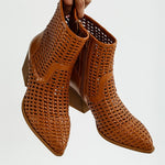 Tri-color collection of women’s woven faux-leather ankle boots with pointed toe and block heel—shown in black, cream, and tan shades.