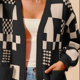 Women's black and cream checkerboard patchwork knit cardigan with open front and front pockets – cozy geometric print sweater for layering.