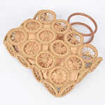 Natural raffia circle-grid handbag featuring wooden round handles and beige drawstring lining.