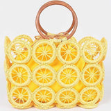 Sunny yellow woven circle-grid tote bag with wooden ring handles and matching fabric lining.