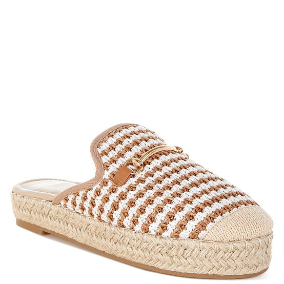 Women’s woven raffia mule espadrille with gold horse-bit hardware and jute platform, shown in black-ivory and tan-white color options.