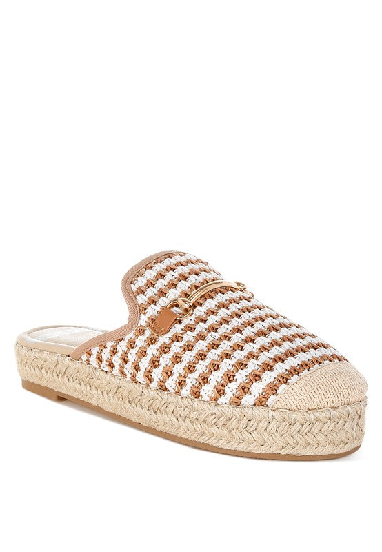 Women’s woven raffia mule espadrille with gold horse-bit hardware and jute platform, shown in black-ivory and tan-white color options.
