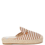 Women’s woven raffia mule espadrille with gold horse-bit hardware and jute platform, shown in black-ivory and tan-white color options.