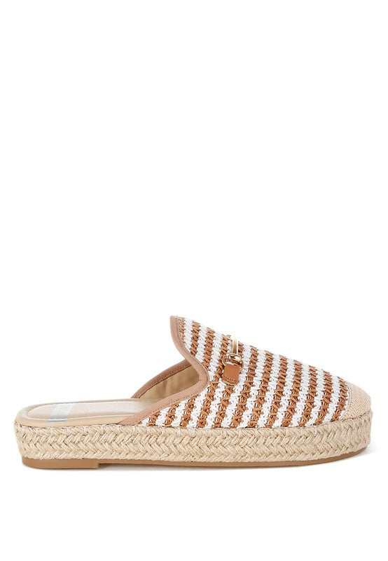 Women’s woven raffia mule espadrille with gold horse-bit hardware and jute platform, shown in black-ivory and tan-white color options.