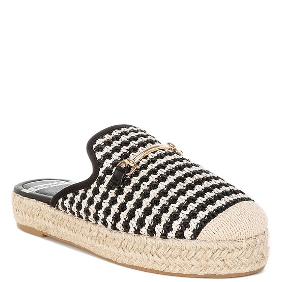 Women’s woven raffia mule espadrille with gold horse-bit hardware and jute platform, shown in black-ivory and tan-white color options.