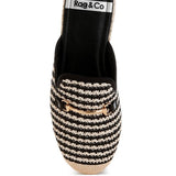 Women’s woven raffia mule espadrille with gold horse-bit hardware and jute platform, shown in black-ivory and tan-white color options.