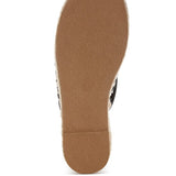 Women’s woven raffia mule espadrille with gold horse-bit hardware and jute platform, shown in black-ivory and tan-white color options.