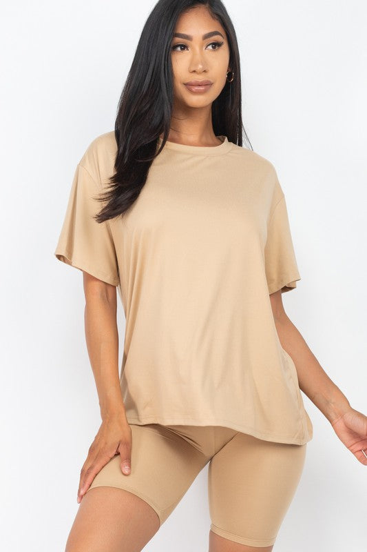 Women's oversized two-piece lounge set featuring a relaxed fit short-sleeve tee and high-waisted biker shorts, available in multiple vibrant colors. Perfect for casual wear, workouts, or athleisure style.