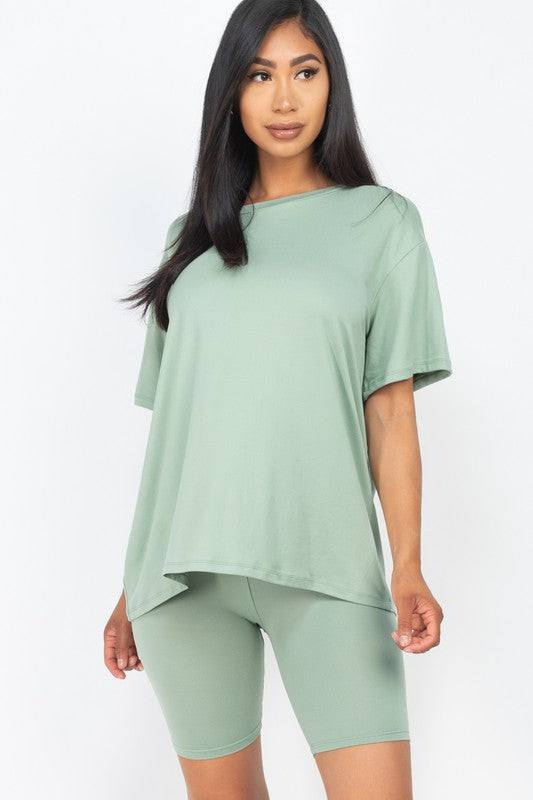 Women's oversized two-piece lounge set featuring a relaxed fit short-sleeve tee and high-waisted biker shorts, available in multiple vibrant colors. Perfect for casual wear, workouts, or athleisure style.