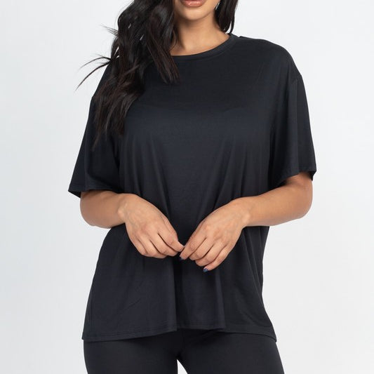 Women's oversized two-piece lounge set featuring a relaxed fit short-sleeve tee and high-waisted biker shorts, available in multiple vibrant colors. Perfect for casual wear, workouts, or athleisure style.