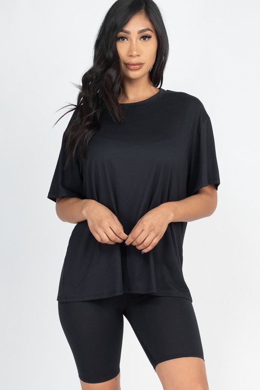 Women's oversized two-piece lounge set featuring a relaxed fit short-sleeve tee and high-waisted biker shorts, available in multiple vibrant colors. Perfect for casual wear, workouts, or athleisure style.