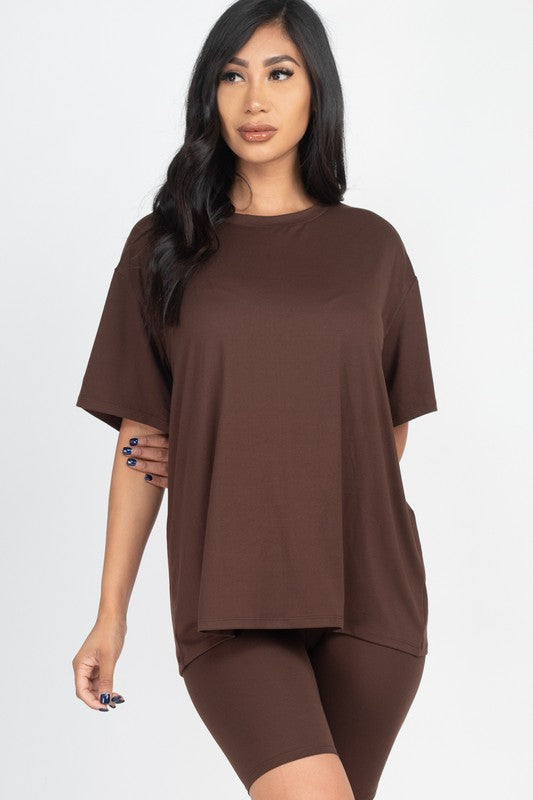 Women's oversized two-piece lounge set featuring a relaxed fit short-sleeve tee and high-waisted biker shorts, available in multiple vibrant colors. Perfect for casual wear, workouts, or athleisure style.