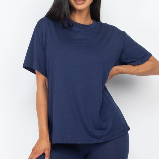 Women's oversized two-piece lounge set featuring a relaxed fit short-sleeve tee and high-waisted biker shorts, available in multiple vibrant colors. Perfect for casual wear, workouts, or athleisure style.
