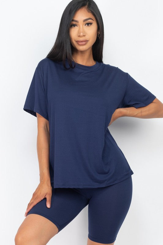 Women's oversized two-piece lounge set featuring a relaxed fit short-sleeve tee and high-waisted biker shorts, available in multiple vibrant colors. Perfect for casual wear, workouts, or athleisure style.