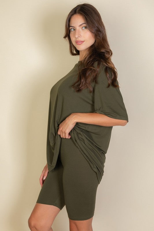 Women's oversized two-piece lounge set featuring a relaxed fit short-sleeve tee and high-waisted biker shorts, available in multiple vibrant colors. Perfect for casual wear, workouts, or athleisure style.