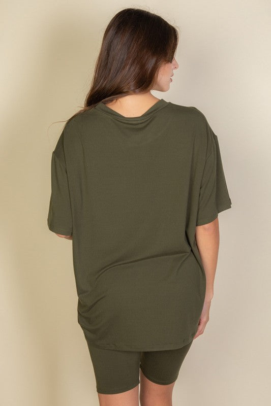 Women's oversized two-piece lounge set featuring a relaxed fit short-sleeve tee and high-waisted biker shorts, available in multiple vibrant colors. Perfect for casual wear, workouts, or athleisure style.
