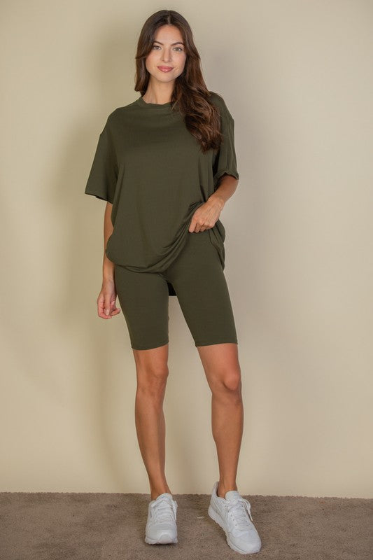 Women's oversized two-piece lounge set featuring a relaxed fit short-sleeve tee and high-waisted biker shorts, available in multiple vibrant colors. Perfect for casual wear, workouts, or athleisure style.