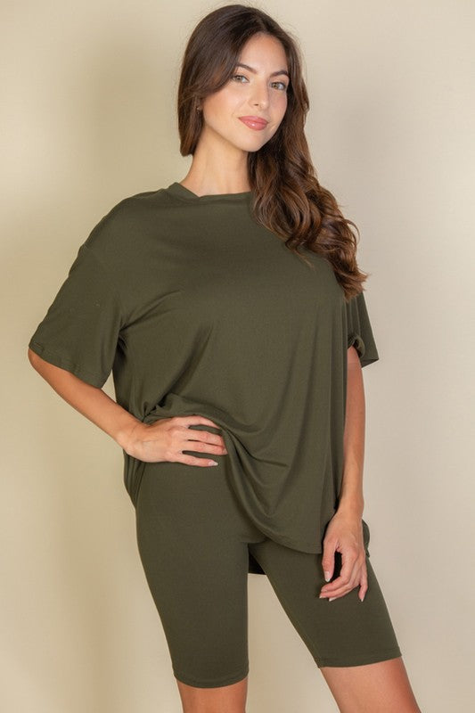 Women's oversized two-piece lounge set featuring a relaxed fit short-sleeve tee and high-waisted biker shorts, available in multiple vibrant colors. Perfect for casual wear, workouts, or athleisure style.