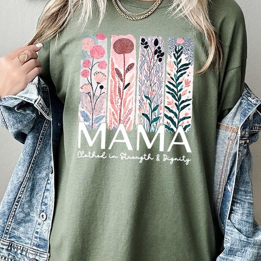 Green T-shirt with pastel pink and teal floral panel design and bold ‘MAMA’ graphic reading ‘Clothed in Strength & Dignity.