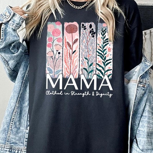 Black T-shirt with pastel pink and teal floral panel design and bold ‘MAMA’ graphic reading ‘Clothed in Strength & Dignity.