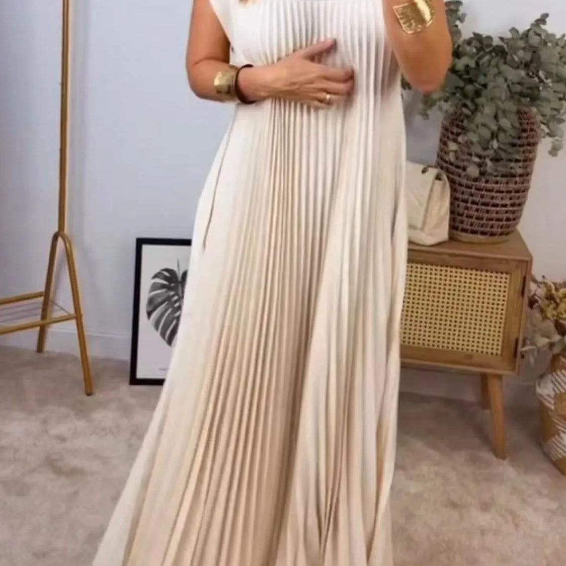 Women's beige pleated maxi dress with cap sleeves and side pockets – elegant flowy summer dress for casual or vacation wear.