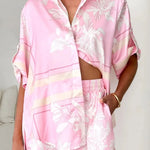Women's blush pink tropical lily stripe two-piece outfit with loose button shirt and comfy drawstring shorts for resort wear.