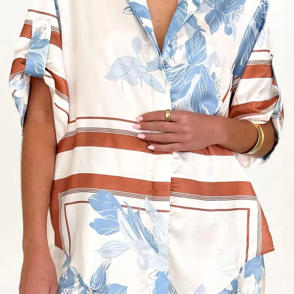 Women's ivory and sky-blue floral stripe Co-Ord set with oversized collared shirt and high-waist shorts – breezy summer matching set.