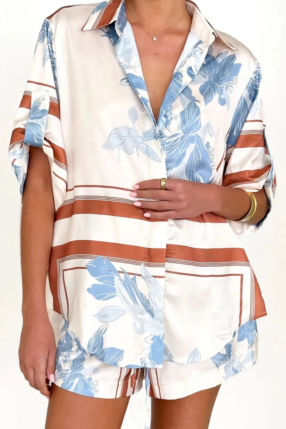 Women's ivory and sky-blue floral stripe Co-Ord set with oversized collared shirt and high-waist shorts – breezy summer matching set.