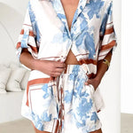 Women's ivory and sky-blue floral stripe Co-Ord set with oversized collared shirt and high-waist shorts – breezy summer matching set.