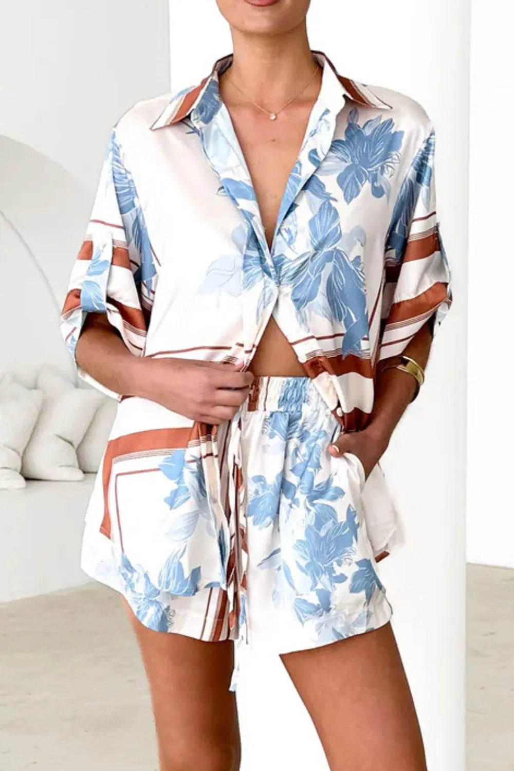 Women's ivory and sky-blue floral stripe Co-Ord set with oversized collared shirt and high-waist shorts – breezy summer matching set.