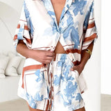 Women's ivory and sky-blue floral stripe Co-Ord set with oversized collared shirt and high-waist shorts – breezy summer matching set.