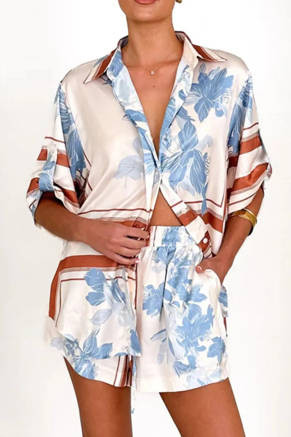 Women's ivory and sky-blue floral stripe Co-Ord set with oversized collared shirt and high-waist shorts – breezy summer matching set.