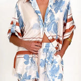 Women's ivory and sky-blue floral stripe Co-Ord set with oversized collared shirt and high-waist shorts – breezy summer matching set.