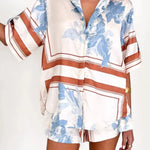 Women's ivory and sky-blue floral stripe Co-Ord set with oversized collared shirt and high-waist shorts – breezy summer matching set.
