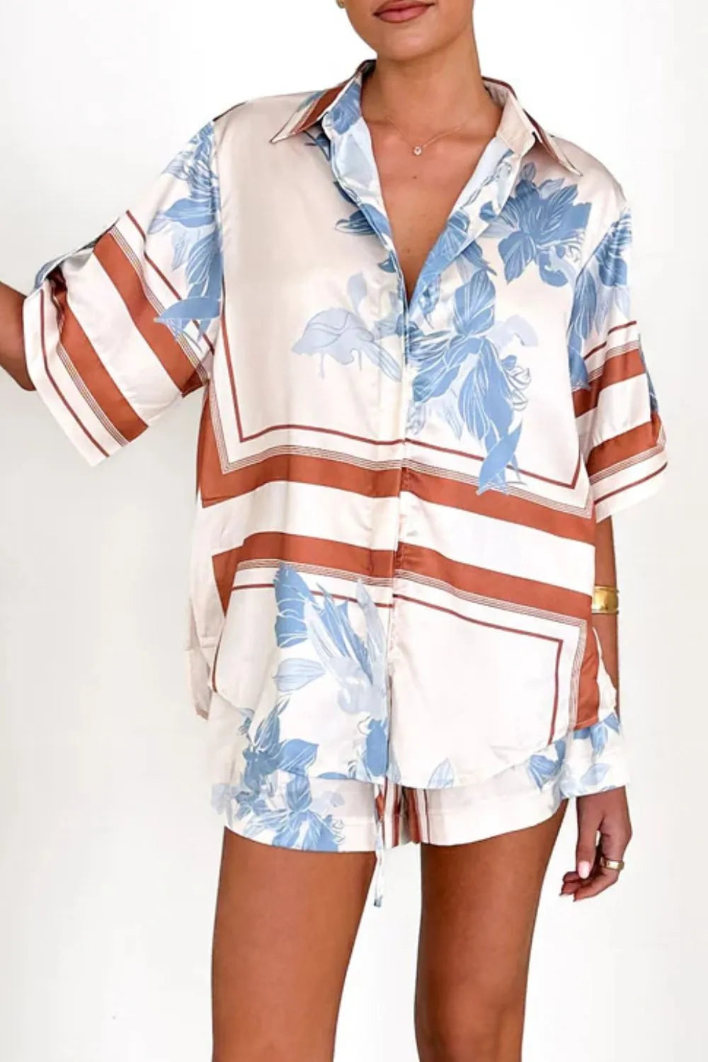 Women's ivory and sky-blue floral stripe Co-Ord set with oversized collared shirt and high-waist shorts – breezy summer matching set.