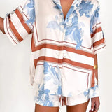Women's ivory and sky-blue floral stripe Co-Ord set with oversized collared shirt and high-waist shorts – breezy summer matching set.