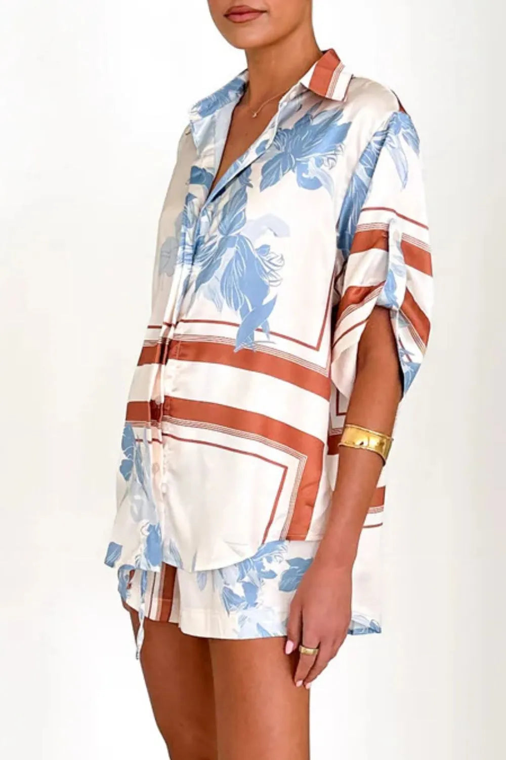 Women's ivory and sky-blue floral stripe Co-Ord set with oversized collared shirt and high-waist shorts – breezy summer matching set.