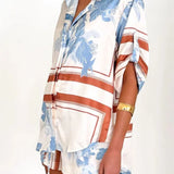 Women's ivory and sky-blue floral stripe Co-Ord set with oversized collared shirt and high-waist shorts – breezy summer matching set.