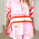 Women's blush pink tropical lily stripe two-piece outfit with loose button shirt and comfy drawstring shorts for resort wear.