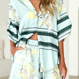Women's seafoam green tropical floral shirt and shorts set featuring relaxed short-sleeve button shirt and elastic waist shorts.