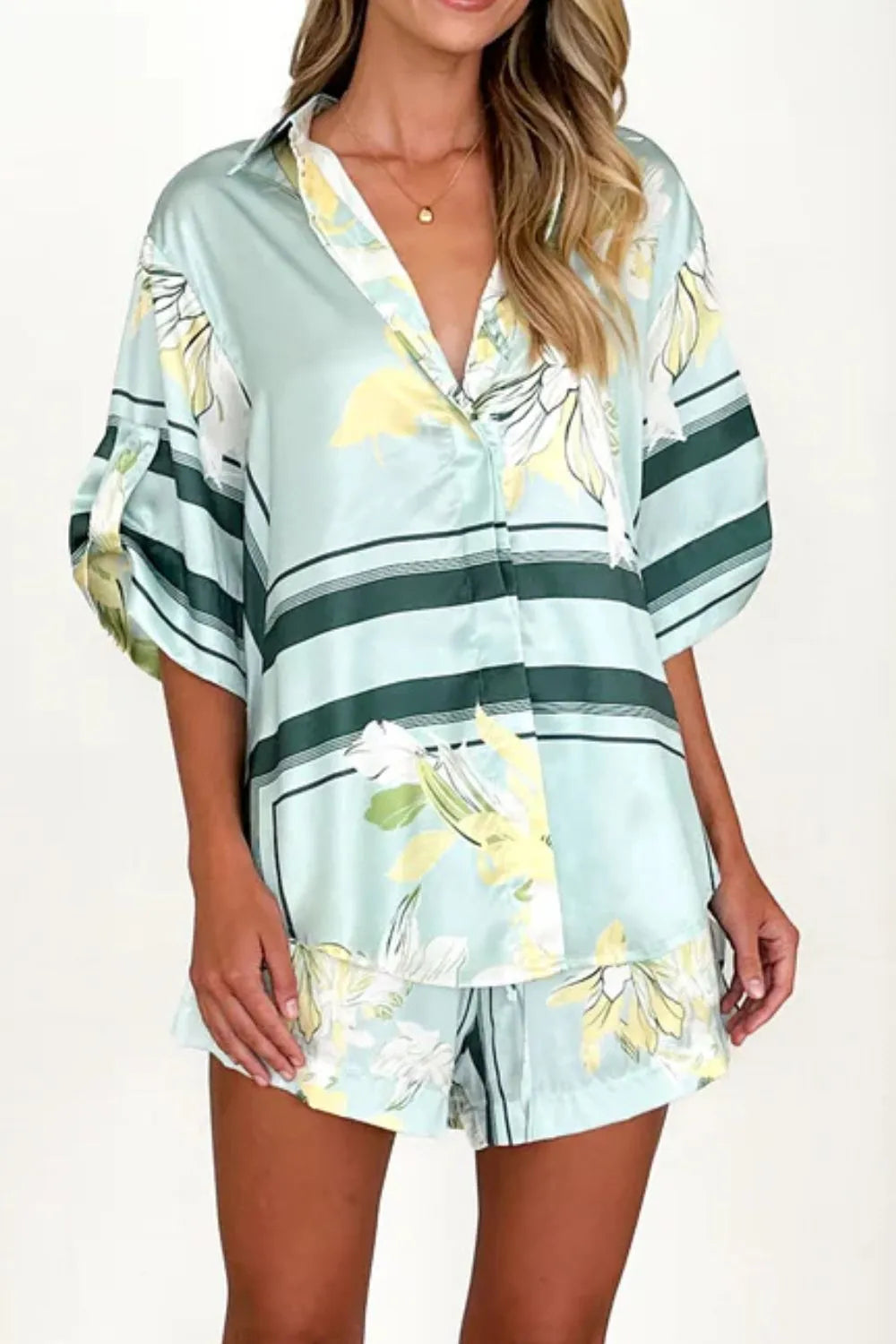 Women's seafoam green tropical floral shirt and shorts set featuring relaxed short-sleeve button shirt and elastic waist shorts.