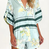 Women's seafoam green tropical floral shirt and shorts set featuring relaxed short-sleeve button shirt and elastic waist shorts.