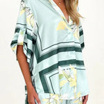 Women's seafoam green tropical floral shirt and shorts set featuring relaxed short-sleeve button shirt and elastic waist shorts.