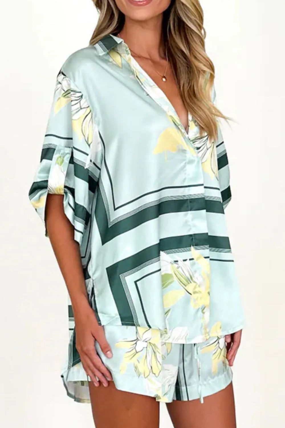 Women's seafoam green tropical floral shirt and shorts set featuring relaxed short-sleeve button shirt and elastic waist shorts.