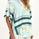 Women's seafoam green tropical floral shirt and shorts set featuring relaxed short-sleeve button shirt and elastic waist shorts.
