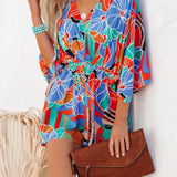Women's multicolor tropical floral and geometric kimono-sleeve romper featuring surplice V-neck, cinched waist, and relaxed shorts—ideal for vacation wear.