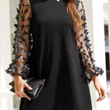 Women's black mini dress with sheer mesh long sleeves and 3D floral appliqués – elegant A-line cocktail dress for parties and special occasions