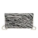 Front view of black and silver rhinestone zebra print clutch with envelope-style flap and silver chain strap.